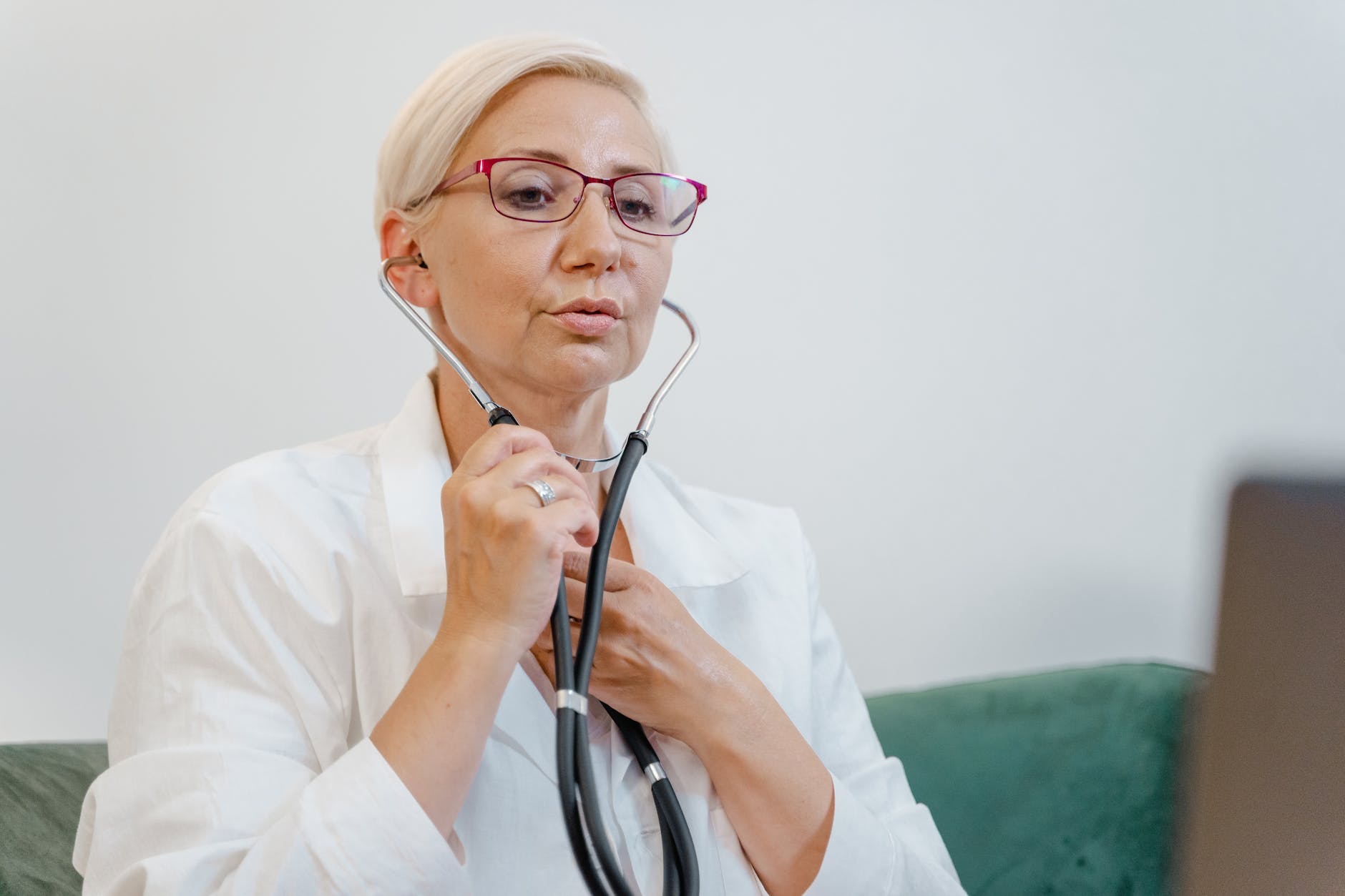 close up shot of a doctor holding stethoscope